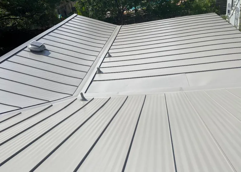 Solar attic fan installed on a metal roof for Roof Ventilation in Chestnuthill